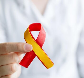 Image of an expectant mother with ultrasound of her baby